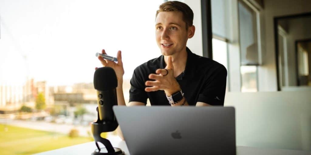 man having podcast