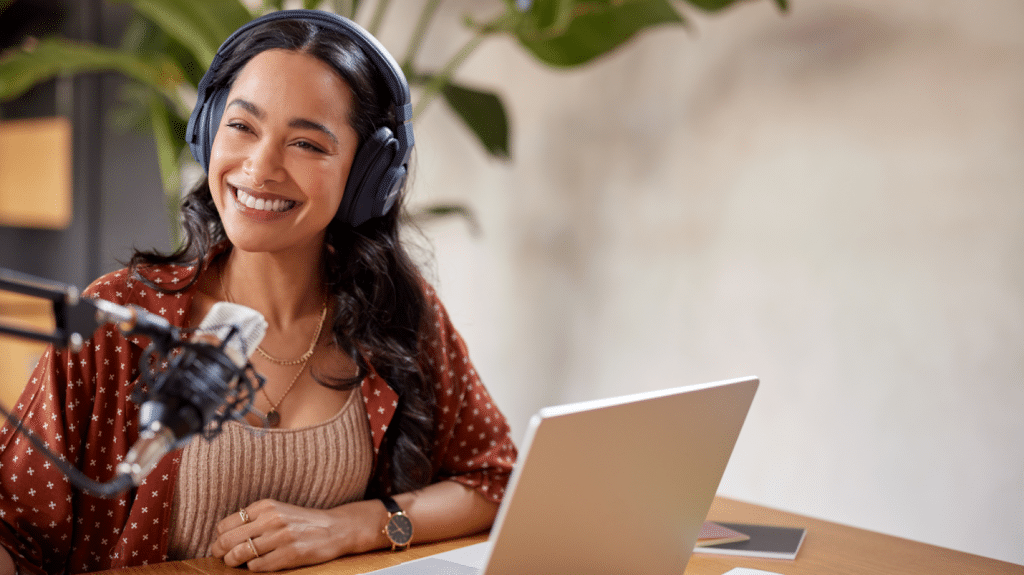 woman with a microphone and laptop